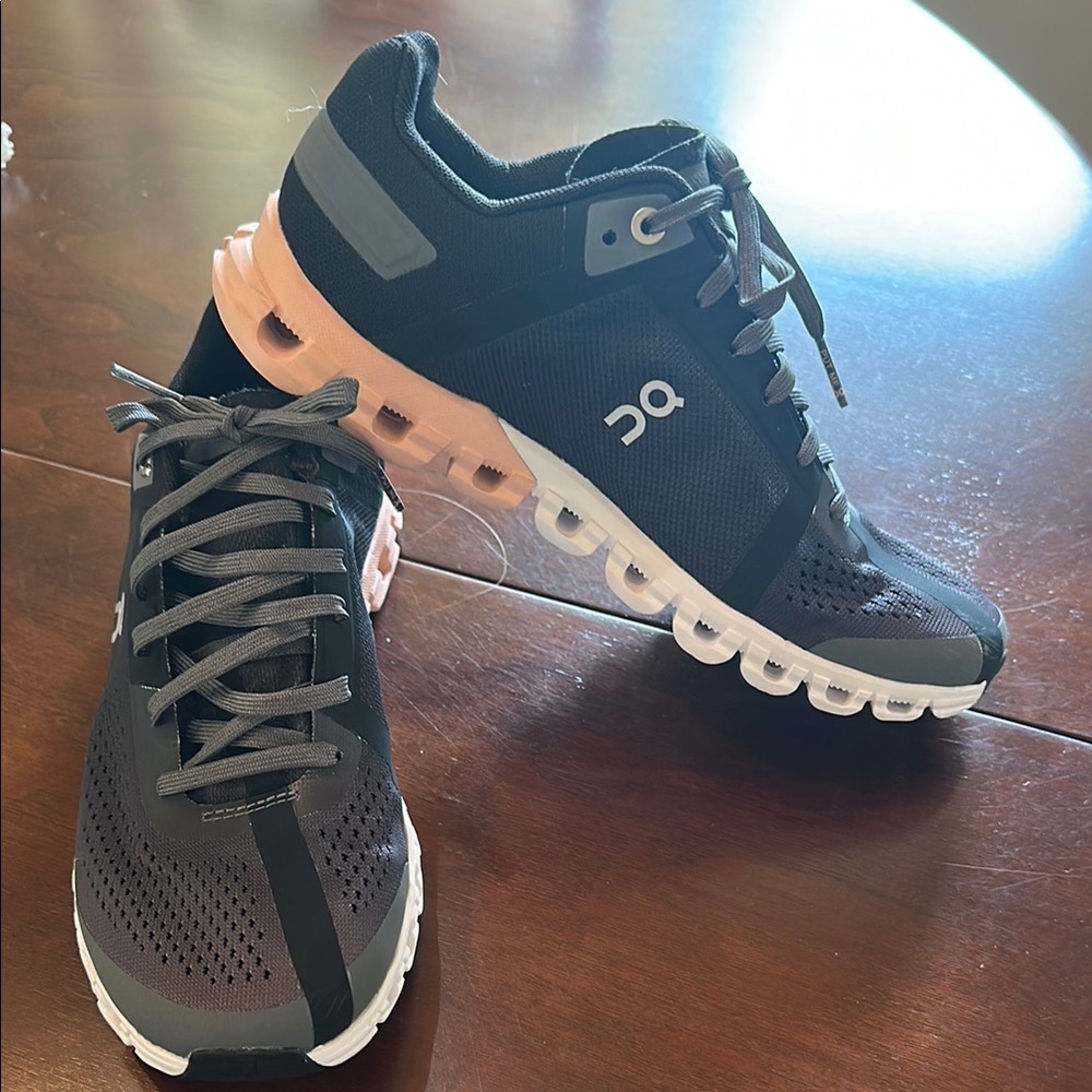 On Running Black and Pink Athletic Shoes with CloudTec Cushioning